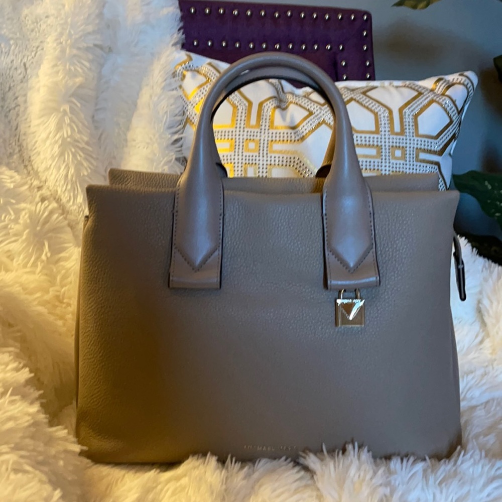 MK satchel in nude tan color.